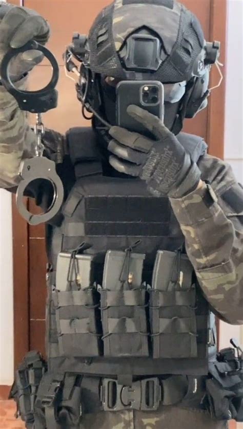 gearswiss porn|SWAT Soldier plays with his guns .